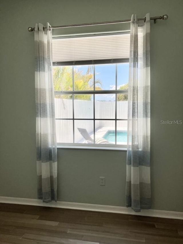 14510 Mj Rd, Myakka City, FL 34251 - spare room featuring wood finished floors and baseboards
