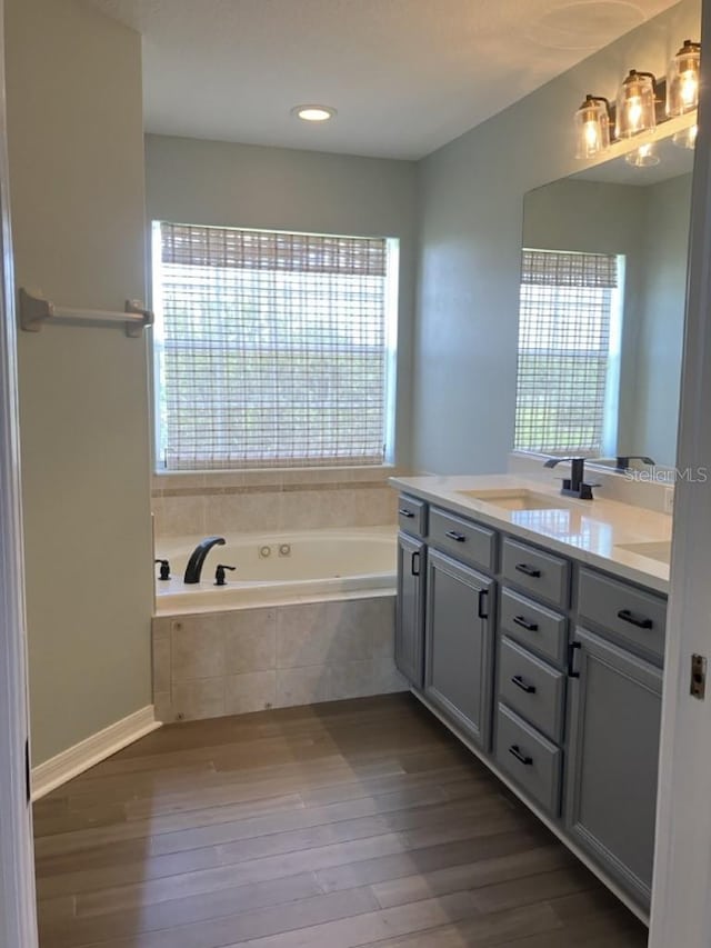 14510 Mj Rd, Myakka City, FL 34251 - bathroom featuring vanity, a bath, wood finished floors, and recessed lighting