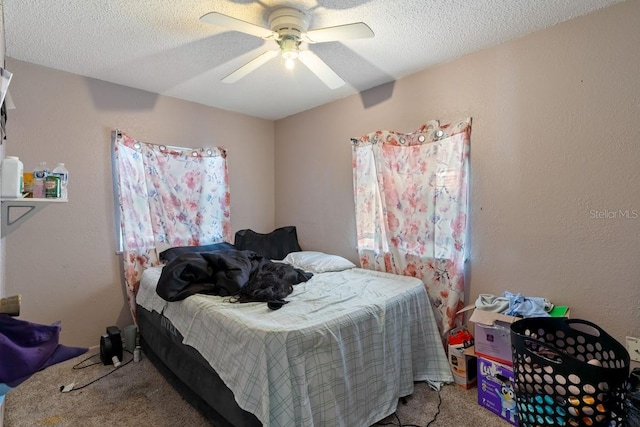 1224 S Delaware Ave, Deland, FL 32720 - carpeted bedroom with a textured ceiling and a ceiling fan