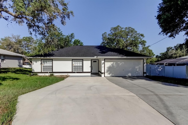 5435 Birchwood Rd, Spring Hill, FL 34608 - ranch-style house featuring driveway, a garage, and stucco siding