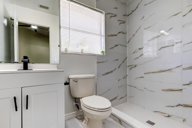 5435 Birchwood Rd, Spring Hill, FL 34608 - bathroom featuring toilet, vanity, a marble finish shower, and baseboards