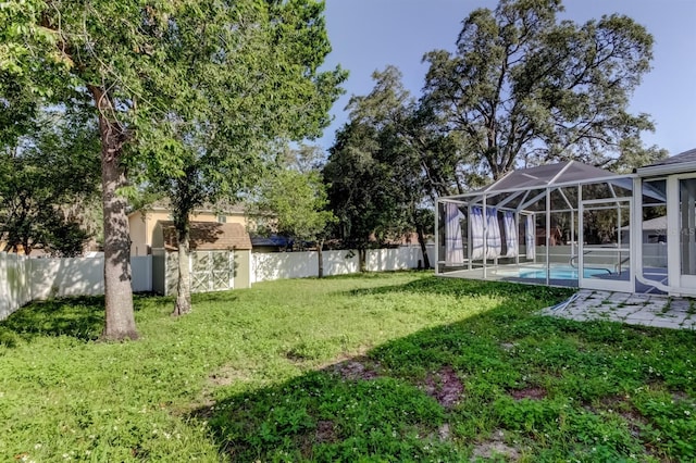5435 Birchwood Rd, Spring Hill, FL 34608 - view of yard with glass enclosure and a patio area