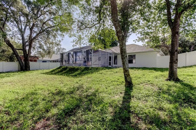 5435 Birchwood Rd, Spring Hill, FL 34608 - back of property with glass enclosure and stucco siding