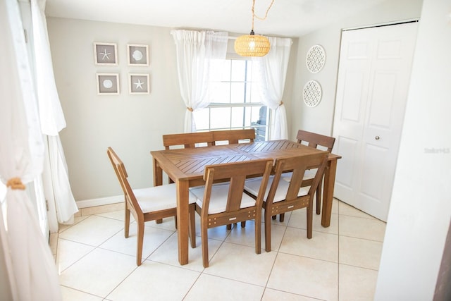 489 Fox Run Trl, Apollo Beach, FL 33572 - dining room with light tile patterned floors and baseboards