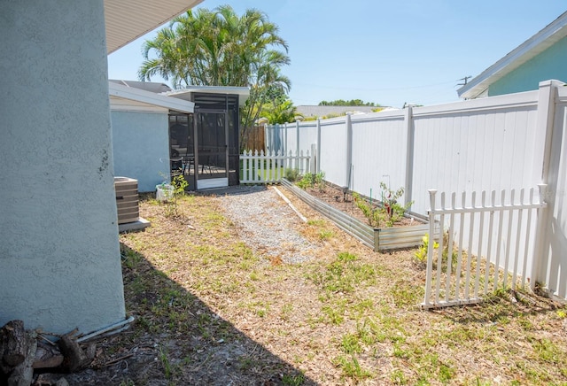 489 Fox Run Trl, Apollo Beach, FL 33572 - view of yard featuring a vegetable garden, a sunroom, and cooling unit