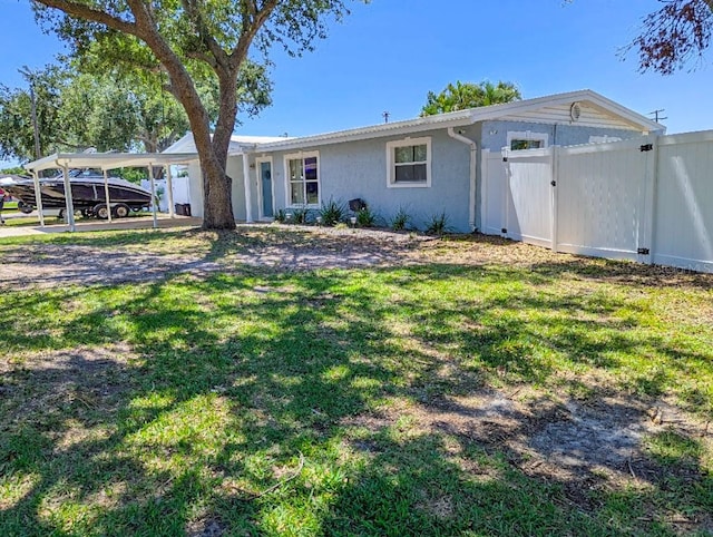 489 Fox Run Trl, Apollo Beach, FL 33572 - ranch-style house with a gate and a carport