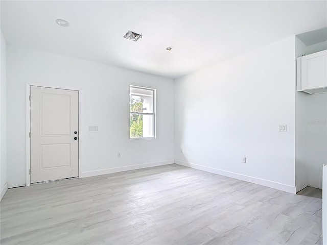 16134 Libourn Ave, Port Charlotte, FL 33954 - spare room featuring light wood-type flooring and baseboards