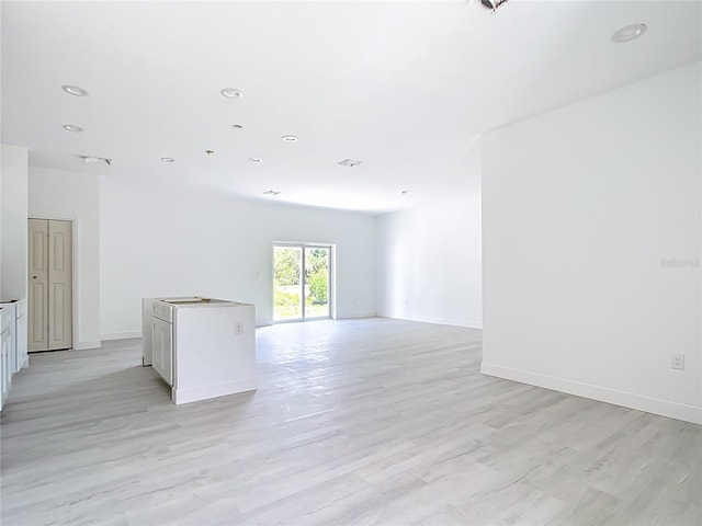 16134 Libourn Ave, Port Charlotte, FL 33954 - unfurnished room with light wood-style flooring, baseboards, and recessed lighting