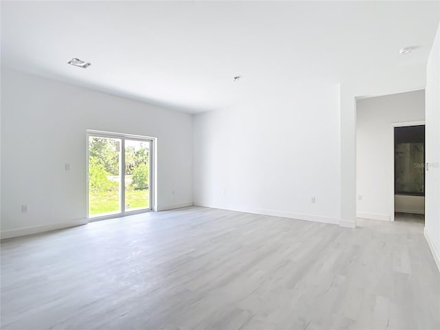 16134 Libourn Ave, Port Charlotte, FL 33954 - empty room with baseboards and light wood-style flooring