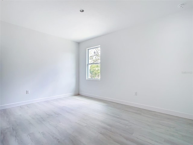16134 Libourn Ave, Port Charlotte, FL 33954 - spare room featuring wood finished floors, baseboards, and a smoke detector