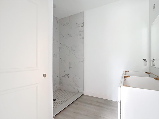 16134 Libourn Ave, Port Charlotte, FL 33954 - bathroom with a marble finish shower and wood finished floors