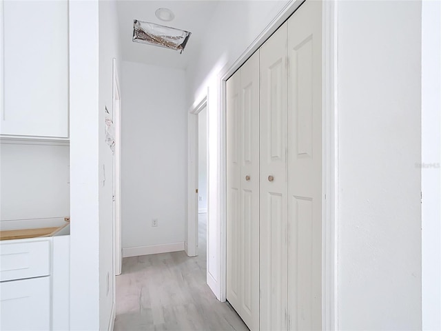 16134 Libourn Ave, Port Charlotte, FL 33954 - hallway with light wood-style flooring and baseboards