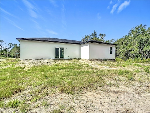 16134 Libourn Ave, Port Charlotte, FL 33954 - back of house featuring stucco siding