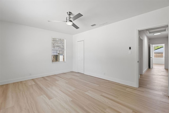 2449 16th St N, Saint Petersburg, FL 33704 - unfurnished room with light wood-style flooring, a ceiling fan, and baseboards