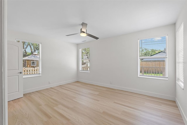 2449 16th St N, Saint Petersburg, FL 33704 - empty room featuring light wood-style flooring, baseboards, and ceiling fan