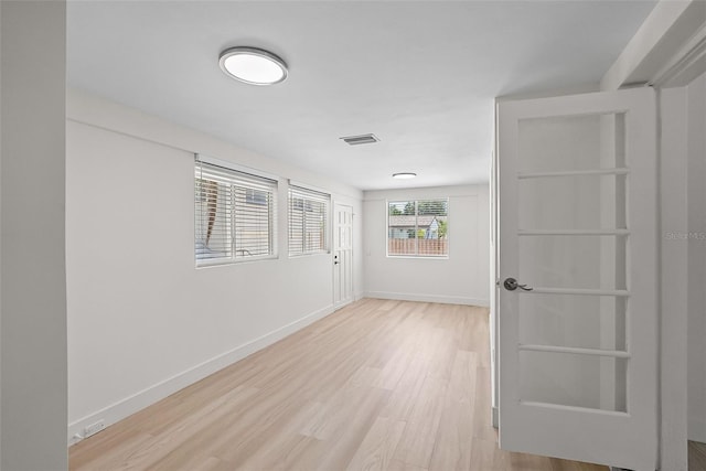 2449 16th St N, Saint Petersburg, FL 33704 - spare room with light wood-style floors and baseboards