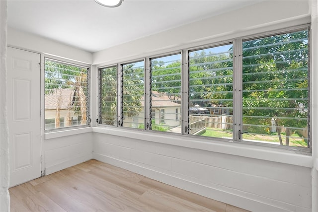 2449 16th St N, Saint Petersburg, FL 33704 - unfurnished sunroom featuring wood finished floors and healthy amount of natural light