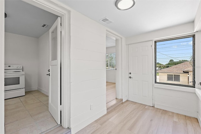 2449 16th St N, Saint Petersburg, FL 33704 - entrance foyer with baseboards and light wood-style flooring