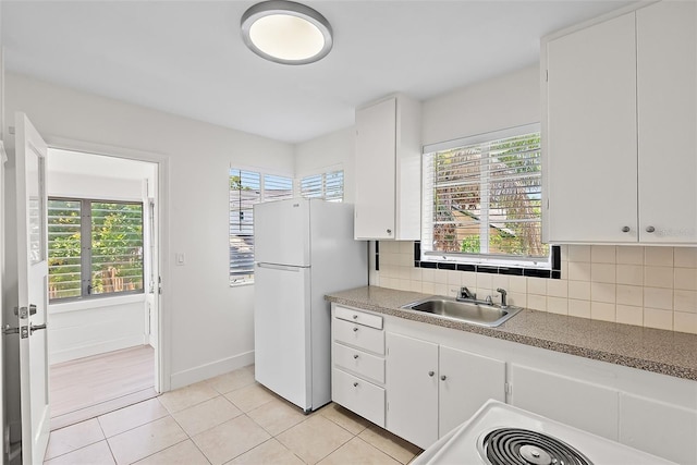 2449 16th St N, Saint Petersburg, FL 33704 - kitchen with a sink, freestanding refrigerator, healthy amount of natural light, and decorative backsplash