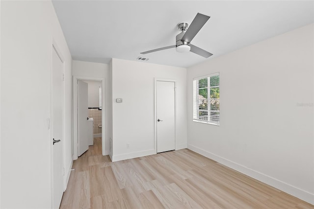 2449 16th St N, Saint Petersburg, FL 33704 - unfurnished bedroom with light wood-type flooring, baseboards, ceiling fan, and a closet
