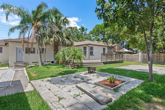 2449 16th St N, Saint Petersburg, FL 33704 - back of house featuring stucco siding, a patio, and a deck
