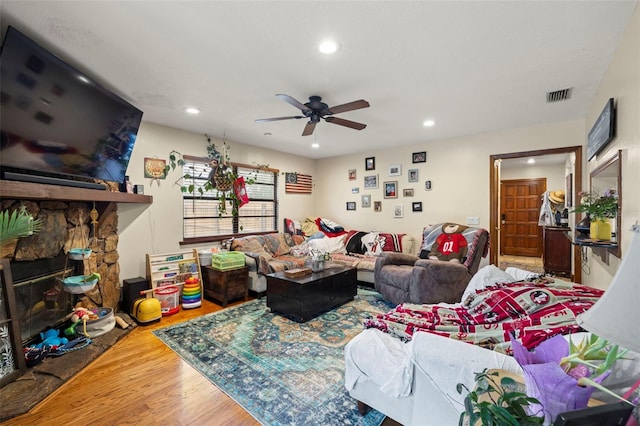 717 E 137th Ave, Tampa, FL 33613 - living area featuring wood finished floors, a ceiling fan, recessed lighting, and a fireplace