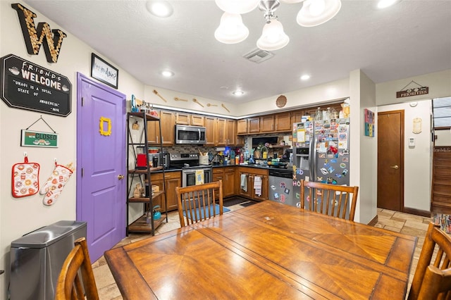 717 E 137th Ave, Tampa, FL 33613 - dining room with a chandelier and recessed lighting