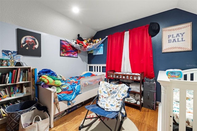 717 E 137th Ave, Tampa, FL 33613 - bedroom with vaulted ceiling and wood finished floors