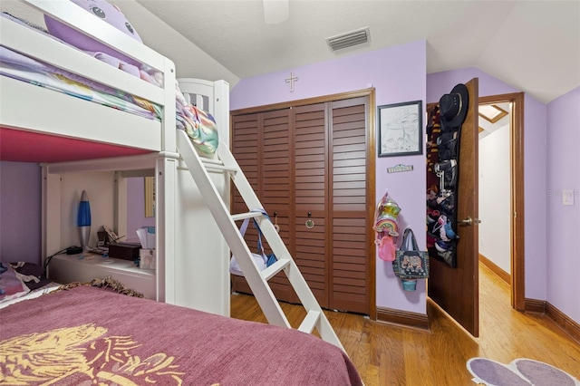 717 E 137th Ave, Tampa, FL 33613 - bedroom featuring vaulted ceiling, a closet, wood finished floors, baseboards, and a ceiling fan