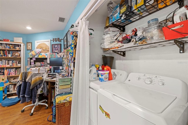 717 E 137th Ave, Tampa, FL 33613 - washroom featuring independent washer and dryer, wood finished floors, and recessed lighting