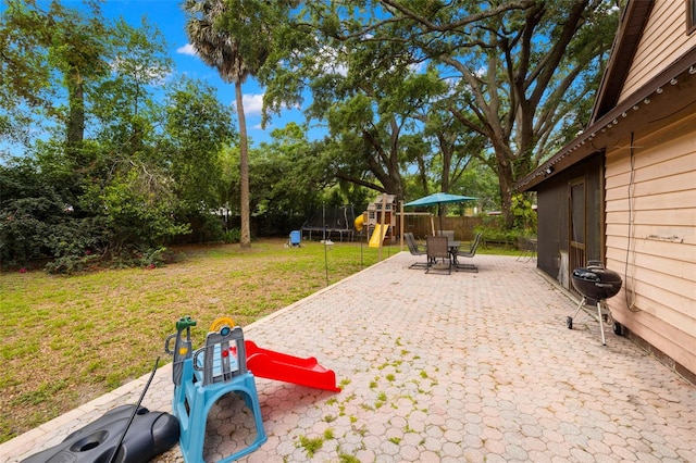 717 E 137th Ave, Tampa, FL 33613 - view of yard with a playground, a patio area, and view of scattered trees