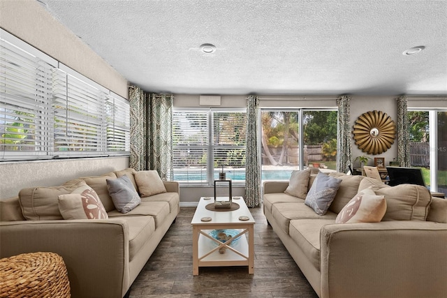 7304 Lakeside Blvd, Tampa, FL 33614 - living room featuring a textured ceiling and wood finished floors
