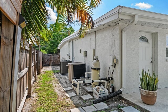 7304 Lakeside Blvd, Tampa, FL 33614 - fenced backyard with central air condition unit and a gate