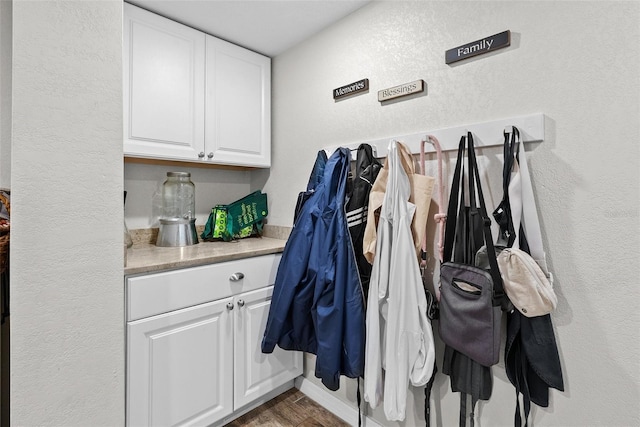 7304 Lakeside Blvd, Tampa, FL 33614 - mudroom featuring a textured wall and wood finished floors