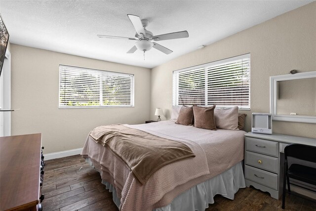 7304 Lakeside Blvd, Tampa, FL 33614 - bedroom with dark wood-style flooring, ceiling fan, and baseboards