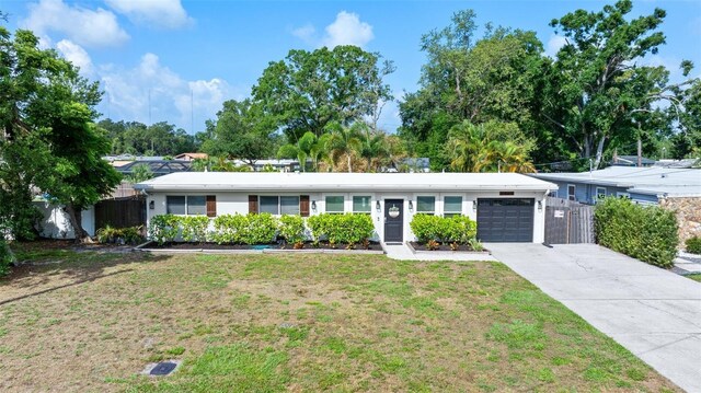 7304 Lakeside Blvd, Tampa, FL 33614 - single story home featuring a garage and driveway