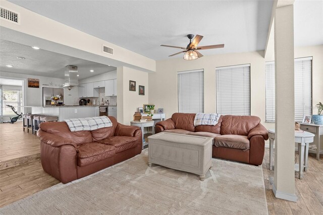 7304 Lakeside Blvd, Tampa, FL 33614 - living area featuring a ceiling fan, light wood-style flooring, and recessed lighting