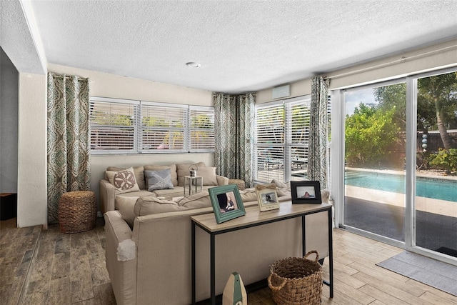 7304 Lakeside Blvd, Tampa, FL 33614 - living area with wood finished floors and a textured ceiling