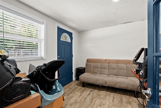 7304 Lakeside Blvd, Tampa, FL 33614 - entrance foyer featuring a textured ceiling and wood finished floors