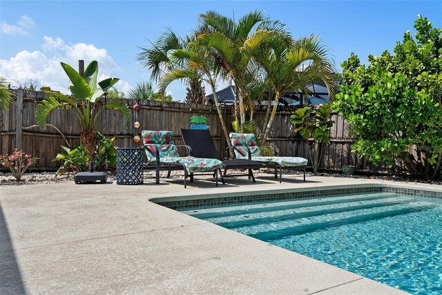 7304 Lakeside Blvd, Tampa, FL 33614 - view of swimming pool featuring a patio area and a fenced backyard