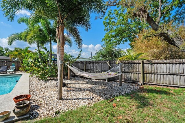 7304 Lakeside Blvd, Tampa, FL 33614 - fenced backyard featuring a patio area