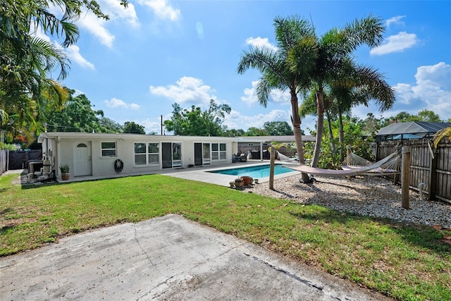 7304 Lakeside Blvd, Tampa, FL 33614 - back of property featuring a patio area and stucco siding