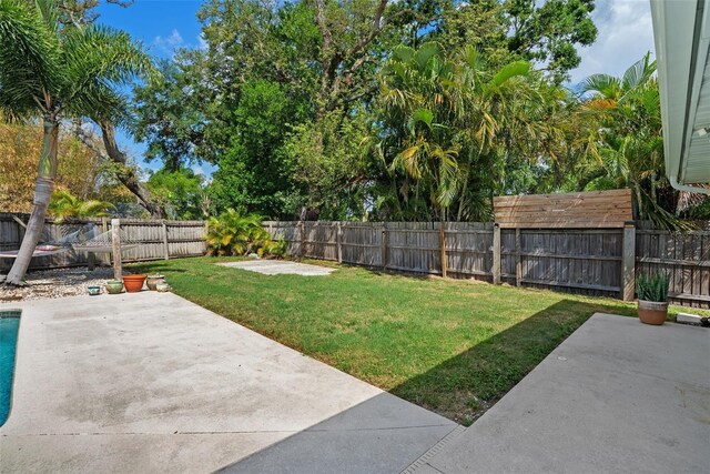 7304 Lakeside Blvd, Tampa, FL 33614 - view of yard featuring a patio area