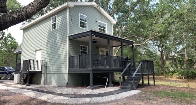 7152 Sandy Ln, Wesley Chapel, FL 33544 - view of home's exterior with a ceiling fan and a wooden deck