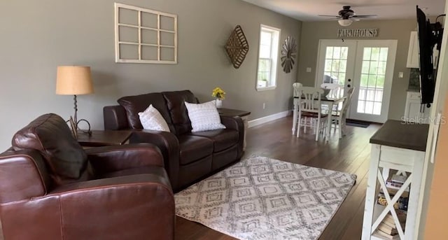 7152 Sandy Ln, Wesley Chapel, FL 33544 - living area featuring a ceiling fan, wood finished floors, baseboards, and french doors