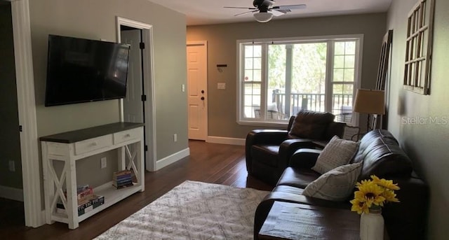 7152 Sandy Ln, Wesley Chapel, FL 33544 - living room featuring ceiling fan, dark wood finished floors, and baseboards