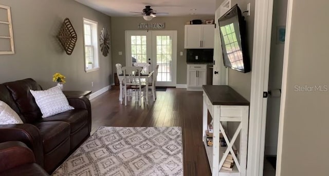 7152 Sandy Ln, Wesley Chapel, FL 33544 - living room with a ceiling fan, dark wood-type flooring, french doors, and baseboards