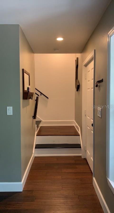 7152 Sandy Ln, Wesley Chapel, FL 33544 - hallway featuring baseboards, wood finished floors, recessed lighting, and stairway