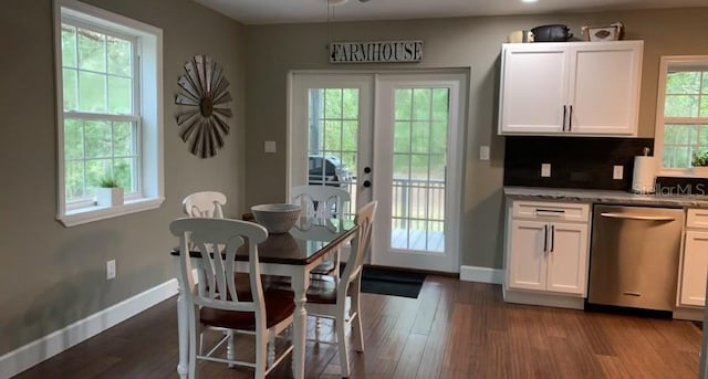 7152 Sandy Ln, Wesley Chapel, FL 33544 - dining space with baseboards, french doors, and dark wood finished floors