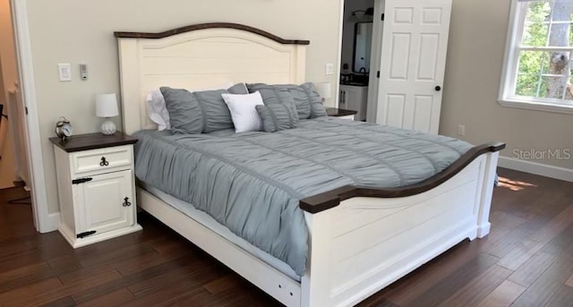 7152 Sandy Ln, Wesley Chapel, FL 33544 - bedroom with dark wood finished floors and baseboards